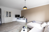 Neuwertige Erdgeschosswohnung mit Terrasse - in zentraler Wohnlage von Aurich - Wohnraum mit Wohnküche