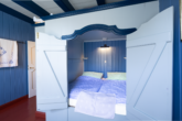 Besondere Lage am Kutterhafen – Ferienhaus mit Hafen- und Weitblick über das Weltnaturerbe Wattenmeer - Schlafzimmer Erdgeschoss - mit Butzenbetten
