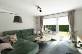 Attraktive Kapitalanlage: Gepflegtes 4-Parteienhaus in ansprechender Lage von Moormerland-Oldersum - WE EG links: Wohnzimmer mit Zugang zur Terrasse