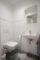 Charmante 2-Zimmerwohnung in einer Neubau-Villa mit Tiefgarage in zentraler Lage von Aurich - Gäste-WC